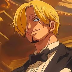 a man with blonde hair wearing a tuxedo in front of a golden background