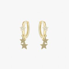 Borrowing inspiration from star constellations, these gold-tone plated earring hoops feature gold hoop with a gleaming star set on and two gold stars hanging. The simple yet trendy design is sure to bring luck and vibrance to any charm outfit.Materials & Finishing: 14K Gold plated sterling brass, 925 silver needleStone: ZirconMeasurements：Diameter: 12mmAllergy Information: Hypoallergenic Tarnish Resistant Star Earrings, Hoop Earrings With Star Charm, Hoop Huggie Earrings With Star Charm, Huggie Earrings With Star Charm, Earring Hoops, Luxury Jewelry Brands, Star Constellations, Star Pendant, Gold Hoop