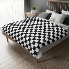 a black and white checkered comforter on a bed