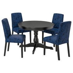 a black table with four blue chairs and a round dining room table in the middle