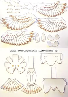 some paper cut outs that have been made to look like an angel's wings