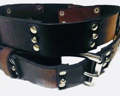 Winter sale! Mothers Day Sale! This black and brown leather studded jeans belt usually retails for $95.00 US. It is now on sale for $71.25 US. This listing is for a 1.25" wide handcrafted black and brown studded leather belt. You have the option to order it with a smooth squared silver buckle or the roller buckle. You also have the option to order it with black and dark brown or black and medium brown. Would you like a leather belt that can last you for years and years? And, what is more, look b Black Leather Belts With Rivets, Black Leather Belt With Rivets, Black Leather Belt For Fall, Plus Size Belt, Belt Plus Size, Mothers Day Sale, Plus Size Belts, Jeans Belt, Fall Sale