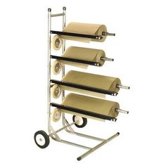 four rolls of toilet paper are on a rolling cart with three wheels and one roll is empty