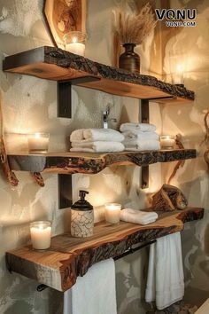 two shelves with candles and towels on them in a bathroom that looks like it has been made out of wood