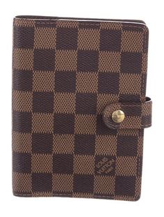 Brown coated canvas Louis Vuitton Damier Ebene Small Ring agenda cover with gold-tone hardware, tonal leather interior, single slit pocket, 3 card slots, brand stamp at interior, pen loop and snap closure at front. Includes ruler insert. From the 2004 Collection. Made in Spain. Brand Stamp, Agenda Cover, Small Ring, Louis Vuitton Damier Ebene, Book Stationery, Brown Coat, Stationery Pens, Damier Ebene, Small Rings