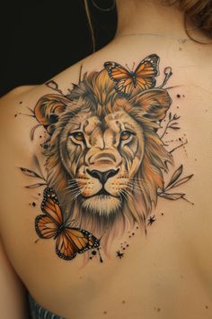 a woman with a lion and butterflies tattoo on her back