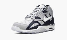 The Nike Air Trainer SC High “Georgetown” is a collegiate-inspired colorway of the retro cross trainer worn by former baseball and football player Bo Jackson back in the day.  The Air Trainer SC High “Georgetown” was released in June 2021 by Nike and its colorway is inspired by the school colors of the Georgetown Hoyas.  The shoe’s perforated upper is designed in versatile Cool Grey leather.  Contrasting Obsidian-colored leather panels are found throughout the look, including on the heel overlay Bo Jackson Sneakers, Nike Air Trainer, Georgetown Hoyas, Kicks Shoes, Bo Jackson, Black Leather Sneakers, Cross Trainer, Nike Brand, Cute Nikes