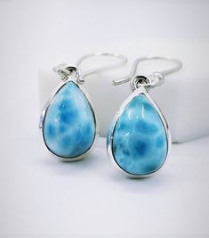 "A beautiful handmade creation of Caribbean Larimar Earrings with Solid Sterling 925 Silver. We make our jewelry with fine quality of workmanship and high quality semi precious stones. The Beautiful Larimar Stone Earrings. This is a beautiful handmade creation. Larimar, also called \"Stefilia's Stone\", is a rare blue variety of the silicate mineral pectolite found only in the Dominican Republic, in the Caribbean. Its coloration varies from white, light-blue, green-blue to deep blue. Larimar is Blue Larimar Earrings For Gift, Blue Larimar Dangle Earrings, Larimar Dangle Earrings For Gifts, Larimar Earrings, Scaredy Cat, Larimar Stone, Les Chakras, Silver Earring, Handmade Pendant