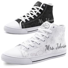 two white and black high top shoes with flowers on the bottom, one has a monogrammed design