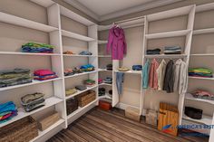 this is an image of a walk - in closet with shelves and clothes on it