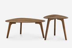 two wooden tables sitting side by side on a white background, one is shaped like an upside down triangle