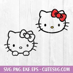 two hello kitty heads with red bows on them, one is black and the other is white