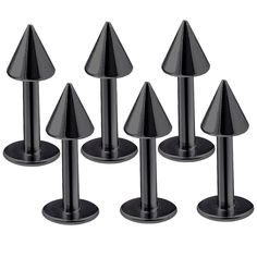 six black metal cones are placed on each other