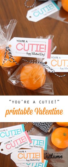 oranges wrapped in cellophane and sitting on a table with tags that say you're a cute printable valentine