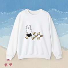 You WILL get stopped in the street and asked where you got this crewneck. Trust me it has happened multiple times haha. Miffy + baby ducklings = cuteness overload.  Ideal for any occasion, this unisex heavy blend crewneck sweatshirt is pure comfort. These garments are made from polyester and cotton. This combination helps designs come out looking fresh and clean. The collar is ribbed knit, so it retains its shape even after washing. There are no itchy side seams on these sweaters.  Materials/Mor Cute Hoodie With Cartoon Print And Crew Neck, Cute Cartoon Print Hoodie With Crew Neck, Cute Cartoon Print Crew Neck Hoodie, Cute Cartoon Print Sweatshirt For Streetwear, Casual White Sweatshirt With Funny Print, Casual Hoodie With Cartoon Print And Crew Neck, Cute Crew Neck Sweatshirt With Screen Print, Cute Crew Neck Hoodie For Streetwear, Casual White Sweatshirt With Cartoon Print