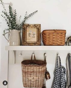 a shelf with baskets and other items on it