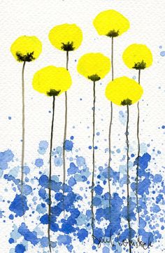 watercolor painting of yellow flowers on white paper with blue ink splatters and blotches