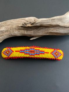 "This is a beautiful Native American hand beaded hair barrett, made by a talented artist of the Lakota Sioux Tribe T. Misery. There's a variety of colors including blue, yellow & orange. This Barrett in excellent condition measures 3.75\" x .75\". Please look closely at the pictures as they are the best indicator of what you will get. This is a lovely piece of Lakota Sioux beadwork which is rare and highly collectable making this a great addition to a collection!! Welcome to NorthWestTrading Sioux Beadwork, Coral Jewelry Vintage, Sioux Tribe, Wire Necklaces, Lakota Sioux, Indian Accessories, Beaded Hair, Indian Hair, Navajo Jewelry