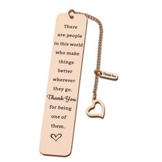 a bookmark with a heart shaped keychain attached to it and the words, there are people in this world who make things better