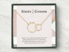 two interlocked rings on a gold plated necklace in a gift box for bridesmaid