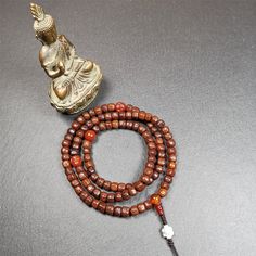 ❤ This old rudraksha mala was handmade from tibetan crafts man in Baiyu County.It's composed of 108 pcs 7mm rudraksha beads,with agate beads,agate guru bead,and silver lucky knot pendant.❤Details:Mala'perimeter is 60cm,24 inches.108 rudraksha beads approximately 7mm / 0.28 inch.1 × agate main bead,diameter 10mm / 0.4 inch.2 × agate maitreya beads diameter 10mm / 0.4 inch.1 × agate guru bead,18mm × 8mm / 0.7 × 0.3 inch.1 × silver lucky knot pendant,10mm × 8mm / 0.4 × 0.32 inch.❤Malas are used all Spiritual Brown Mala For Healing, Brown Mala For Healing And Festivals, Holistic Brown Mala With 108 Beads, Spiritual Brown Agate Beads, Adjustable Brown Mala With Gemstone Beads, Brown Mala With Round Beads For Healing, Adjustable Brown Gemstone Beads Mala, Spiritual Agate Mala With Round Beads, Spiritual Agate Mala With 108 Beads