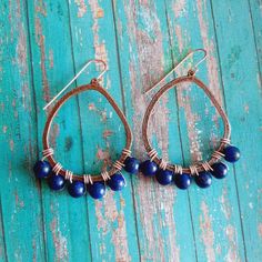 "Lapis Lazuli Gemstone Copper Hoop wire wrapped Dangle Earrings These Lapis Lazuli Earrings are  light weight and comfortable. Put them on with a pair of jeans and a white T and they will jazz up your style. They can also be worn with various earth tone colors if you are going for a rustic look Length: 2\" COMES IN A GIFT BOX" Blue Bohemian Teardrop Earrings With Wire Wrapped, Blue Wire Wrapped Bohemian Teardrop Earrings, Bohemian Blue Wire Wrapped Teardrop Earrings, Lapis Lazuli Earrings, Earth Tone Colors, Hippy Gifts, Ear Wire, Jewelry Earrings Hoops, Lapis Lazuli