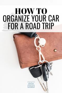 a brown wallet with keys in it and the words how to organize your car for a road trip