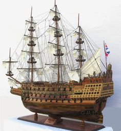 a wooden model of a sailing ship