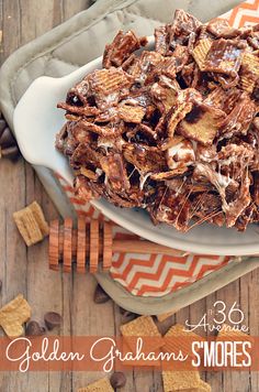 a white plate topped with chocolate covered graham s'mores and chips on top of a wooden table