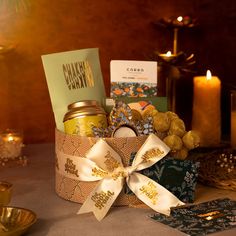 a table topped with candles and greeting cards