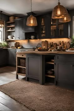 a kitchen with dark wood cabinets and lights hanging from the ceiling, along with an area rug on the floor