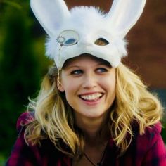 a woman wearing a bunny mask and smiling