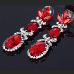 Wicked Wonders VIP Bling Earrings Queen of the Three Red Gem Statement Earrings Affordable Bling_Bling Fashion Paparazzi Red Crystal Drop Earrings, Red Bling Jewelry For Evening, Glamorous Red Jewelry With Sparkling Stones, Formal Red Sparkling Jewelry, Red Sparkling Stones Drop Earrings, Red Sparkling Crystal Jewelry, Red Rhinestone Evening Earrings, Red Stone Earrings For Wedding, Glamorous Red Crystal Jewelry