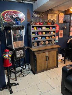 a room filled with lots of different types of furniture and decor on display in front of a blue wall