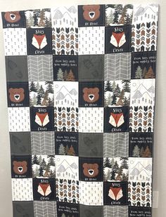 a quilt made to look like a bear in the woods