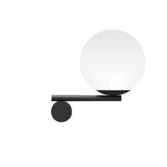 a white ball sitting on top of a metal pole next to a black object with a round light