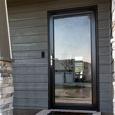 the front door to a house with a fire hydrant