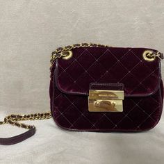 Michael Kors Plum Velvet Sloan Medium Quilted Leather Messenger Shoulder Bag. **Rare** **Willing To Negotiate Price!!!** Bag Converts From Crossbody To Shoulder Bag By Doubling Strap Color: Burgundy/Plum Gold Hardware And Crossbody Chain Interior Features Center Zip Compartment, 1 Zip Pocket, 1 Open Slip Pocket And 4 Card Slots 23"L Pull-Through Strap Push-Lock Closure Slight Scratches On Gold Plaque Quilted Rayon Velvet; Lining: Polyester Size: 8-1/2"W X 7-3/4"H X 1/2"D Mk Wallet, Floral Backpack, Black Crossbody Purse, Michael Kors Crossbody Bag, Michael Kors Crossbody, Black Leather Crossbody Bag, Crossbody Wallet, Crossbody Messenger Bag, Black Crossbody