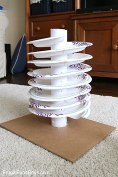 a stack of plates sitting on top of a rug