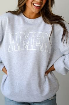 We love the message on the Heather Grey Amen Sweatshirt! This comfy sweatshirt is designed with a soft and stretchy knit with a fleece interior. It features a crew neckline, long sleeves, a relaxed fit, and the word "Amen" on the front. Style the Heather Grey Amen Sweatshirt with your favorite denim and sneakers for a casual look! Soft + Stretchy Knit Fabrication Fleece Interior "Amen" Graphic Crew Neckline Long Sleeves Relaxed Fit 80% Cotton, 20% Polyester Machine Wash Cold Inside Out, Tumble D Sweaters Trendy, Summer Walks, Cricut Project Ideas, Sweatshirt Style, Clothing Cute, Cute Boutiques, Everyday Basics, Cute Rompers, Comfy Sweatshirt