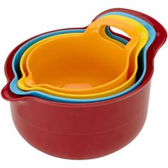 three red bowls with yellow and blue handles are stacked on top of each other in the same bowl