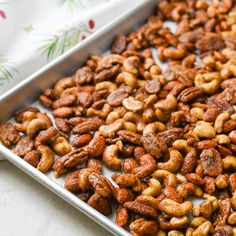 a pan filled with nuts sitting on top of a table