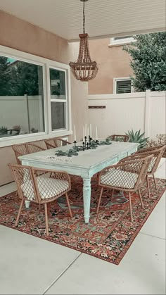 a dining room table with chairs around it