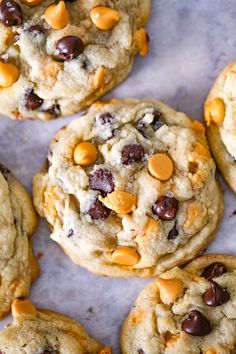 two cookies with chocolate chips and almonds on top