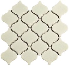 white tile with an intricate pattern on the top and bottom half, in various sizes