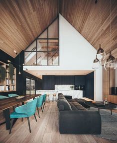 a living room filled with furniture next to a wooden ceiling