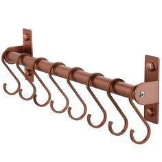 a set of four metal hooks on the side of a coat rack with five hooks attached to it