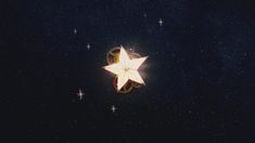 a white star is shining in the night sky