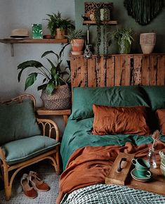 a bed room with a neatly made bed and lots of plants