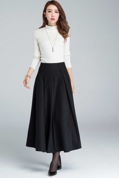 "Find your warm winter skirt from Xiaolizi. The black pleated skirt made from soft wool fabrication in a pull-on construction + flowing A-line silhouette. The maxi skirt features two side entry pockets and right zipper closure. DETAILS: * 30% wool, 30% fiber, 40% polyester * fully satiny liner * Two seam pockets * Hidden zipper in the right side * Pleated details * Midi Length * Perfect for autumn, winter * Dry clean CUSTOM MADE SERVICE If you * Need a tailored clothes with your body measurement Pleated Maxi Skirt For Winter Workwear, Winter Wide Leg Maxi Skirt, Winter Pleated Full Maxi Skirt, Skirts Winter, Casual Formal Dresses, Skirt Wool, Tailored Clothes, Womens Skirts, Body Measurement